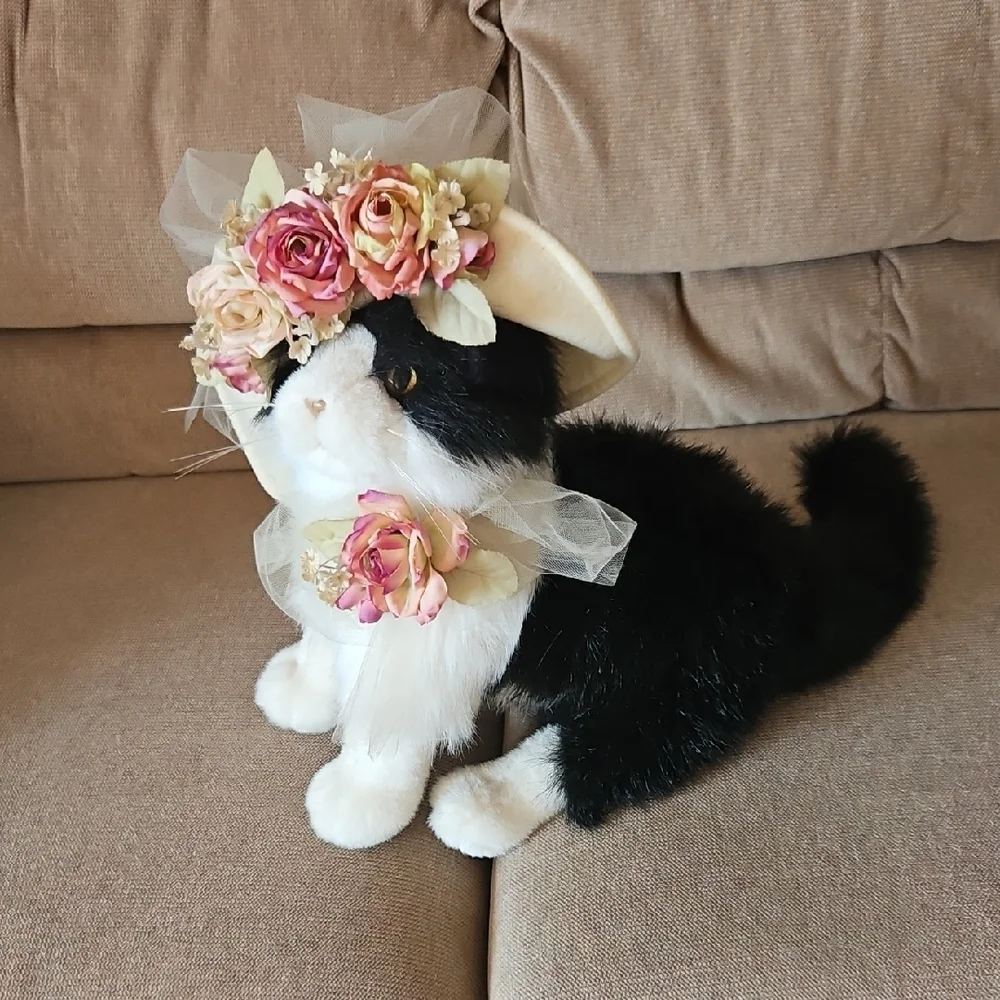 Black and White Plush Cat with flowered hat.